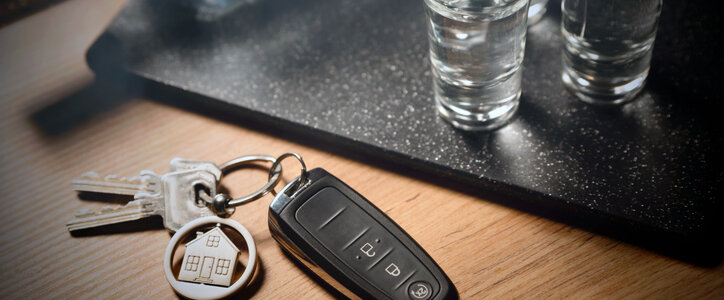 Drink and drive, alcoholism with car keys concept